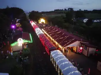Train at night with Christmas lights from high up